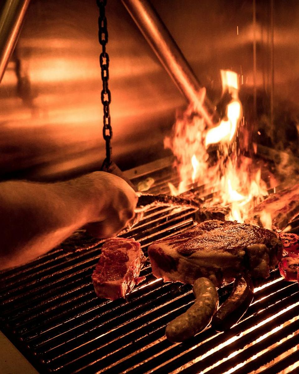 Steak and skewers over the wood fire at Lolinda's asador