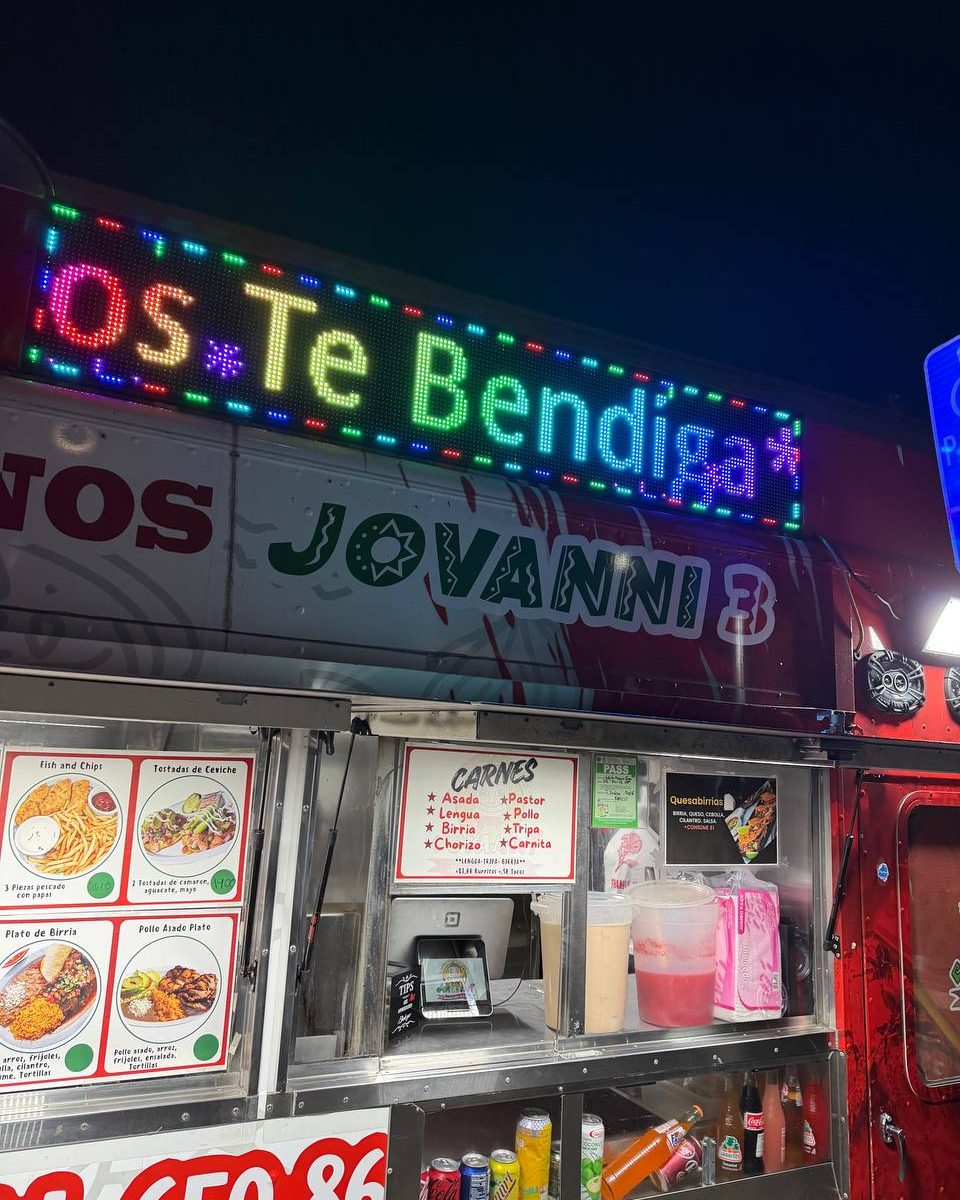 The Jovanni 3 taco truck at night, LED sign reading Dios Te Bendiga